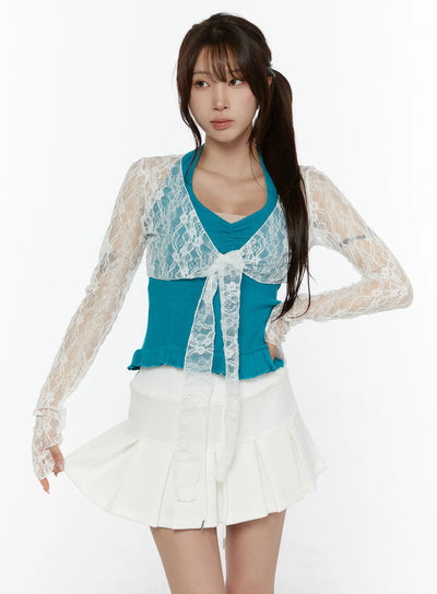 LEWKIN Lace Front-Tie Bolero CL507 White S/M front shot on model wearing teal ribbed top and white pleated mini skirt, sheer floral lace fabric