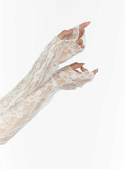 Lace Front-Tie Bolero CL507 White detail shot of both arms showing sheer floral lace long sleeves with fingerless open-hand cuffs and ruffled trim