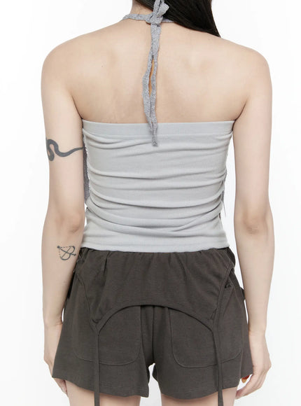 Lace Halter-Neck Top IL522 Gray back shot model showing open bare back with lace halter neck tie knot detail and ribbed inner lining with dark shorts