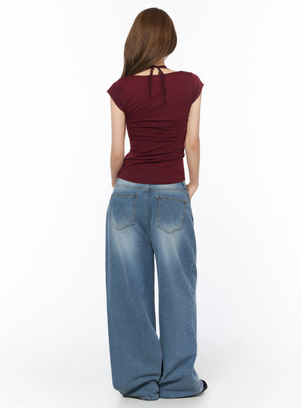 Lace Halter Tee IU525 Dark red full-body back shot on model, lace tie detail at back neckline, cap sleeves, fitted silhouette with jeans