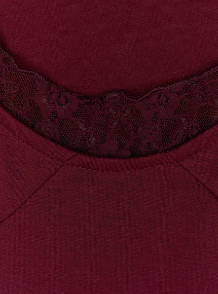 Lace Halter Tee IU525 Dark red close-up detail shot of floral lace U-neckline trim and empire seam line on dark red jersey fabric