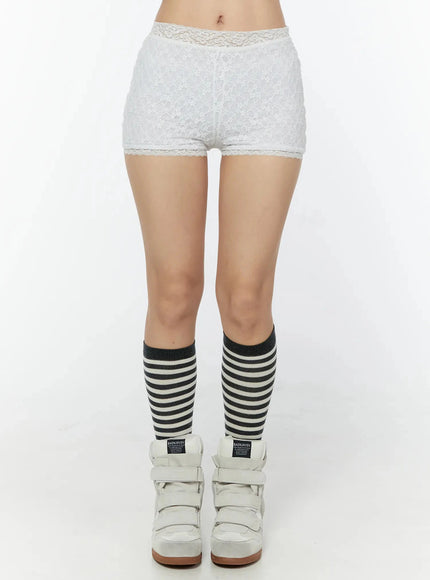 LEWKIN Lace Layered Micro Shorts IU524 White front view on model cropped at waist showing floral lace texture lace trim waistband and hem with striped knee socks