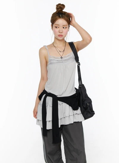 LEWKIN Lace Ruffle Mini Dress CL501 Gray S/M styled shot model wearing lace trim cami with tiered ruffle hem, black jacket tied at waist, crossbody bag
