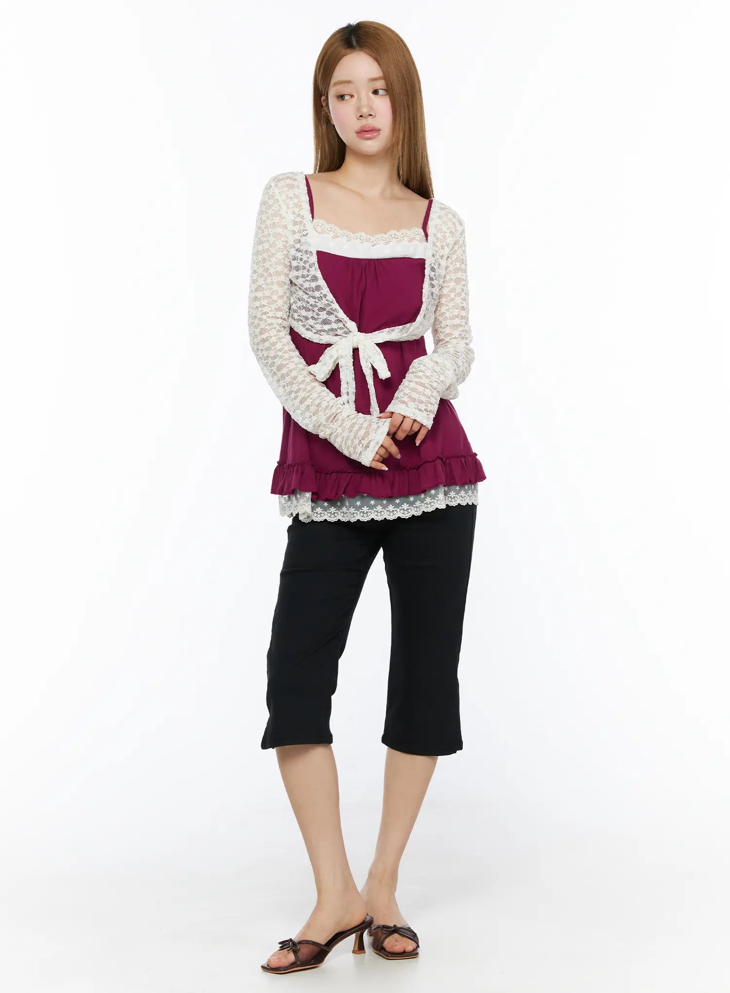 Lace Sheer Crop Cardigan CL502 White full-length front shot on model paired with magenta ruffle cami and black cropped pants, gazing to the side