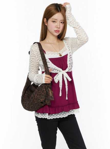 LEWKIN Lace Sheer Crop Cardigan CL502 White S/M front shot on model styled over magenta cami with lace bow tie and ruffle hem, carrying leopard bag
