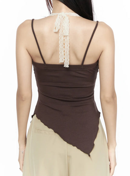 Lace Trim Asymmetric Cami CL524 Brown close-up back shot on model showing cream lace ribbon back detail spaghetti straps jersey fabric and asymmetric scalloped hem
