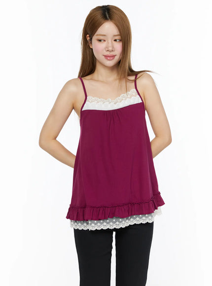 Lace Trim Cami Top CL502 Dark red three-quarter front view on model with slight turn, white lace chest trim and lace ruffle hem, black pants