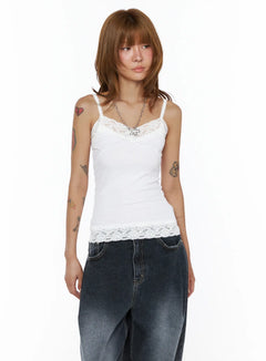 LEWKIN Lace Trim Cami Top CL503 White front view on model wearing ribbed cami with floral lace V-neckline and lace hem, styled with dark wide-leg jeans