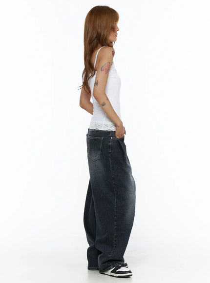 Lace Trim Cami Top CL503 White full-body side view on model showing slim ribbed silhouette, lace-trimmed hem, and spaghetti straps styled with wide-leg jeans