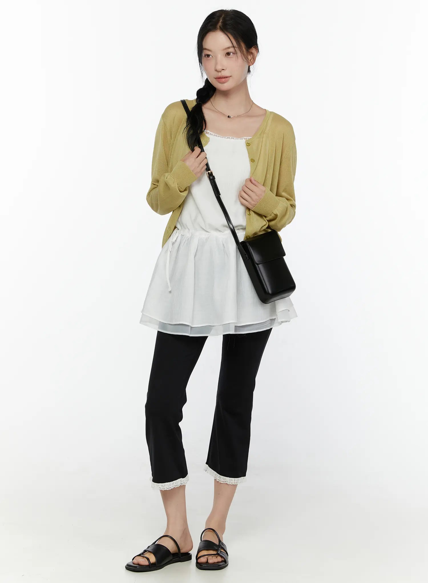 Lace Trim Cami Top CL520 White styled full-body front shot on model layered under olive cardigan with black crossbody bag black cropped pants and slide sandals