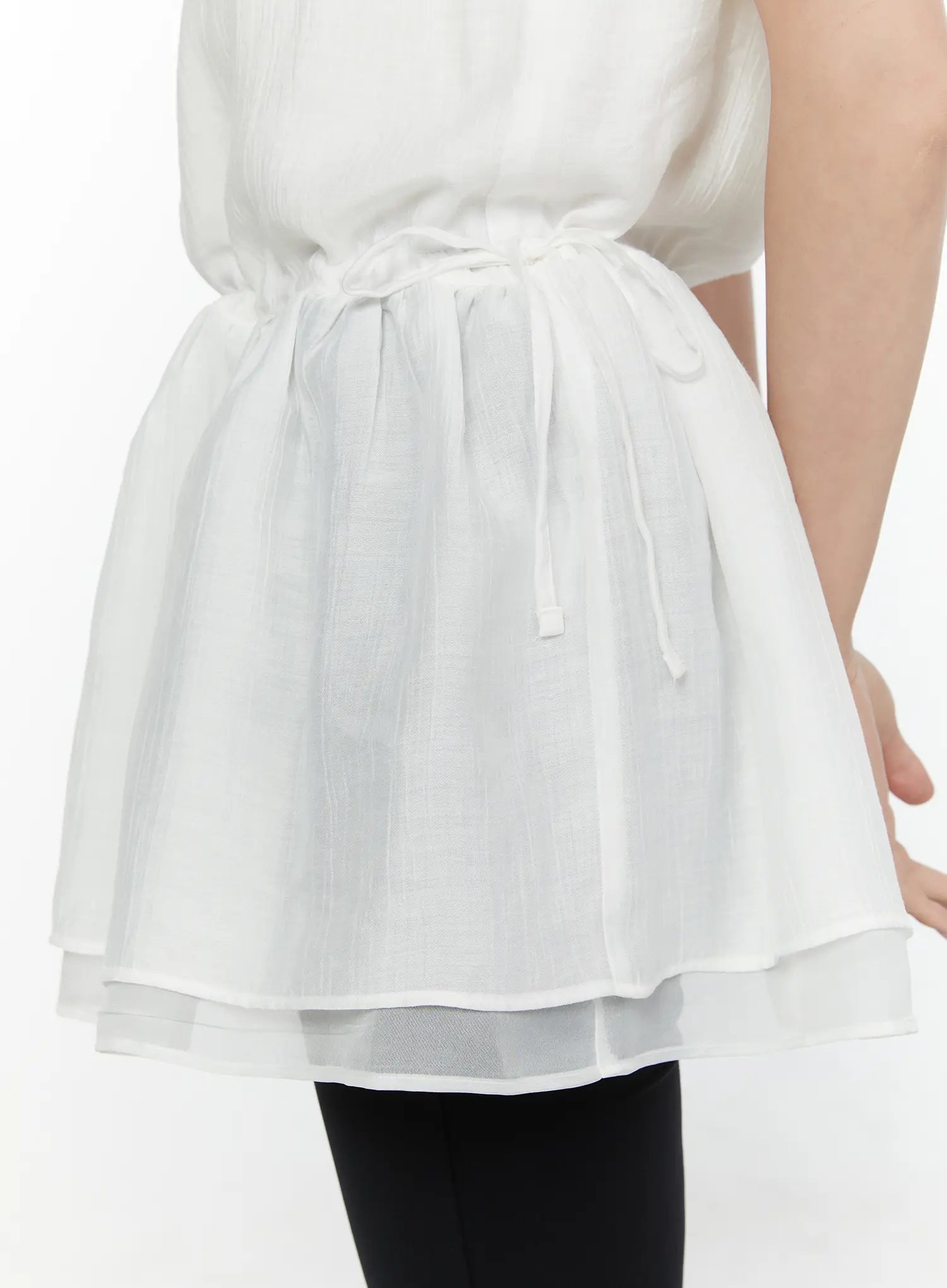 Lace Trim Cami Top CL520 White close-up detail shot of drawstring waist tie gathered peplum hem and double-layer sheer organza hem in crinkle chiffon
