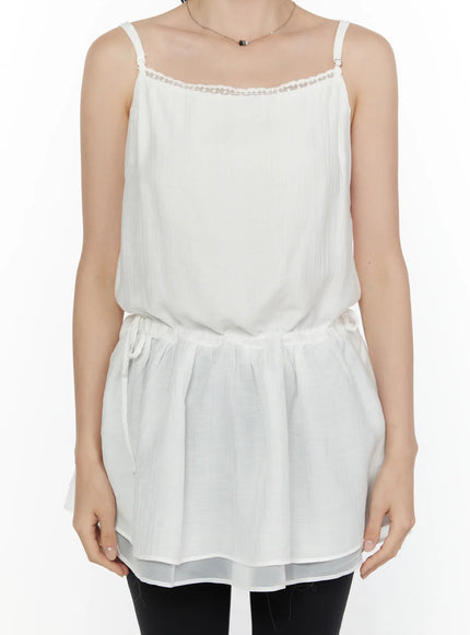 Lace Trim Cami Top CL520 White close-up front torso shot on model showing lace neckline trim adjustable spaghetti straps and crinkle chiffon fabric texture