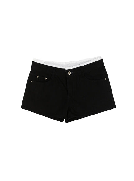 Lace Trim Cotton Shorts IL523 Black flat-lay front view showing low-rise silhouette, silver rivets, front pockets, and white scalloped lace waistband trim