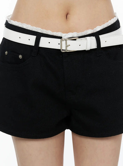 Lace Trim Cotton Shorts IL523 Black close-up front detail on model showing white belt, silver rivet pocket hardware, and lace waistband trim