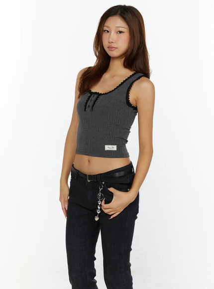 Lace-Trim Crop Tank Top CL515 Grey front model shot three-quarter angle showing black lace trim ribbed fabric button detail and woven label with black jeans