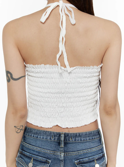 Lace Trim Halter Neck Cami CL508 White back close-up detail shot on model showing smocked elastic back panel and halter neck tie strap in textured white fabric