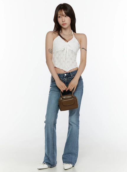 Lace Trim Halter Neck Cami CL508 White full-length front model shot standing upright holding brown mini bag paired with flare jeans and white flats