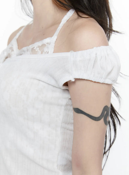 Lace Trim Halter Top IL522 White S/M close-up detail shot of off-shoulder puff sleeve lace halter strap and ribbed knit fabric texture on model