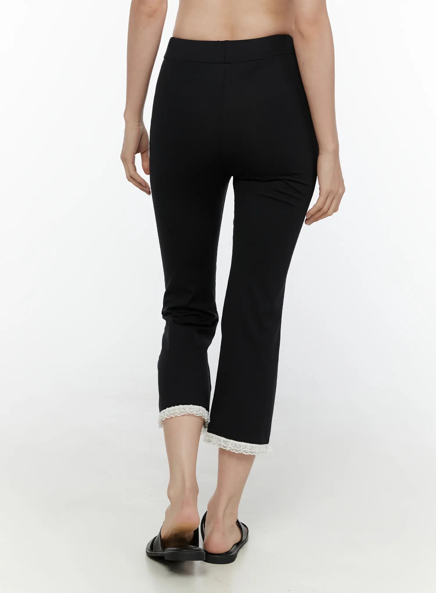 Lace Trim High-Waist Capri Pants CL520 Black back view on model showing smooth high waistband fitted seat cropped flare hem with white lace trim and sandals