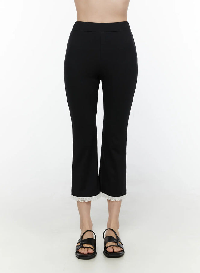 LEWKIN Lace Trim High-Waist Capri Pants CL520 Black front view on model size S/M showing slim fit cropped flare silhouette with white lace hem trim and black sandals