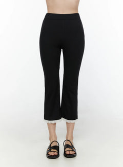 LEWKIN Lace Trim High-Waist Capri Pants CL520 Black front view on model size S/M showing slim fit cropped flare silhouette with white lace hem trim and black sandals