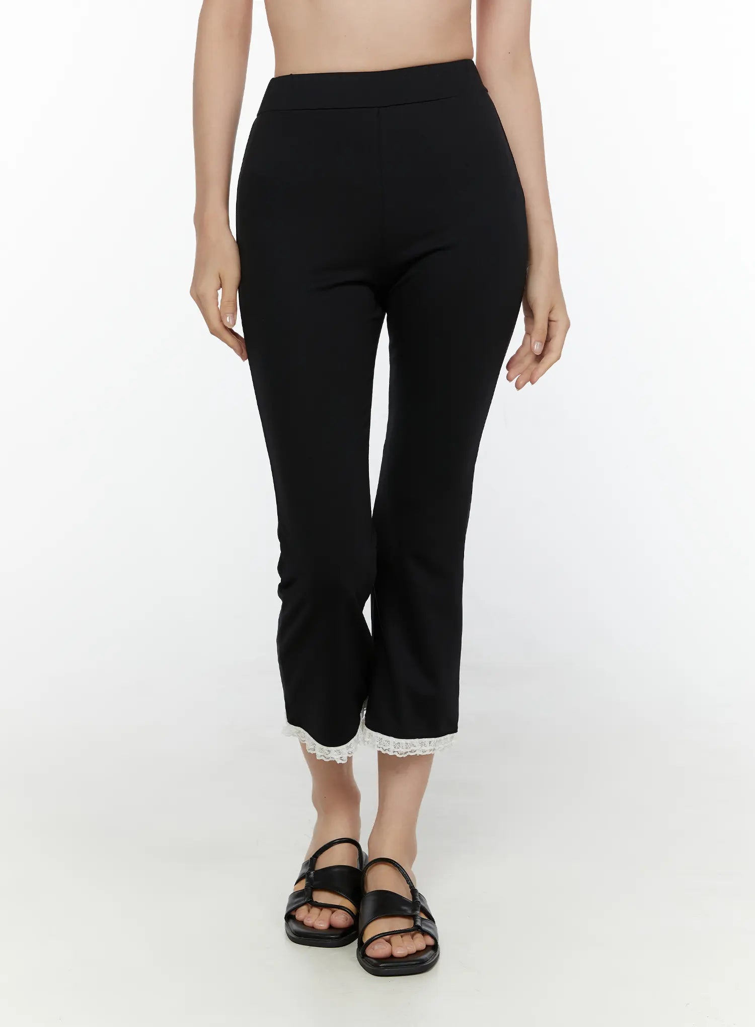 Lace Trim High-Waist Capri Pants CL520 Black front view on second model showing high waistband slim cropped flare fit with white lace trim hem and black sandals