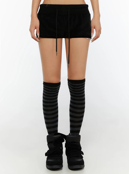 Lace-Trim Layered Shorts IL524 Black front shot on model showing shorts with drawstring waist and lace trim, styled with striped over-knee socks