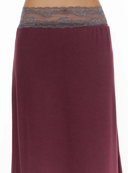Lace Trim Midi Skirt CL503 Dark red close-up detail of gray floral lace waistband against dark red jersey fabric on model