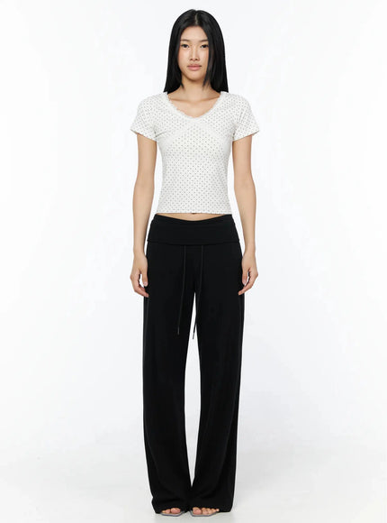Lace Trim Polka Dot Top IL509 White full-length front shot on model standing straight, showing overall fit with black wide-leg pants