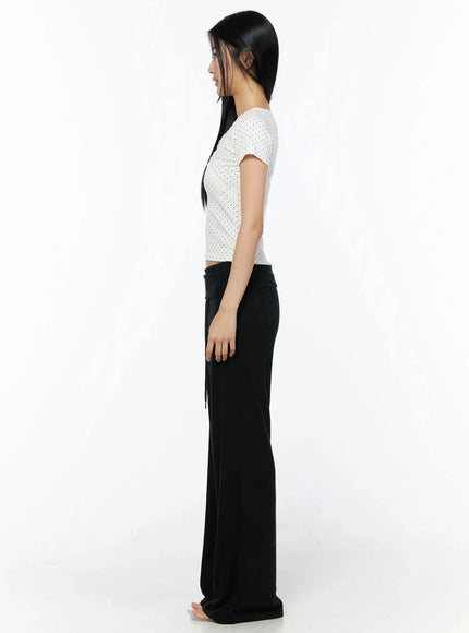 Lace Trim Polka Dot Top IL509 White side shot on model showing slim cropped silhouette and short sleeve with polka dot knit fabric