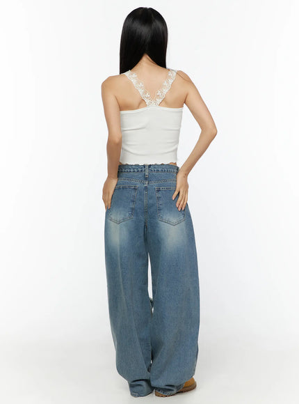 Lace Trim Tank CU526 White full-body back view on model, floral lace racerback detail, ribbed texture, lettuce hem, paired with wide-leg blue jeans