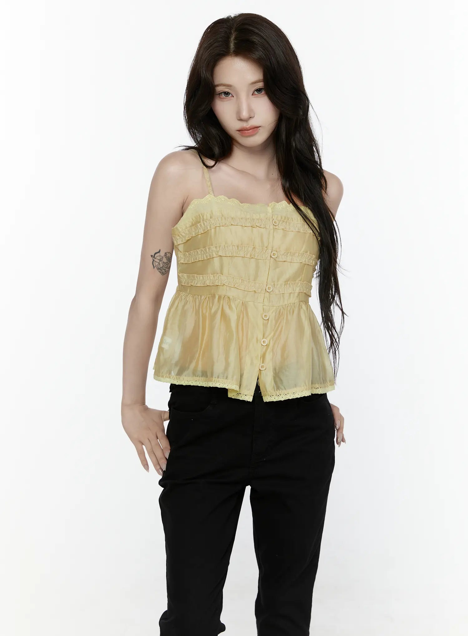 Lace Trim Tank IL521 Yellow front shot on model showing sheer organza tiered ruffle bodice center buttons lace trim hem with black pants