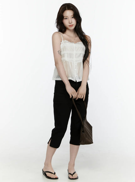 Lace Trim Tank IL521 White full-body front shot on model styled with black cropped pants flip flops and brown tote bag