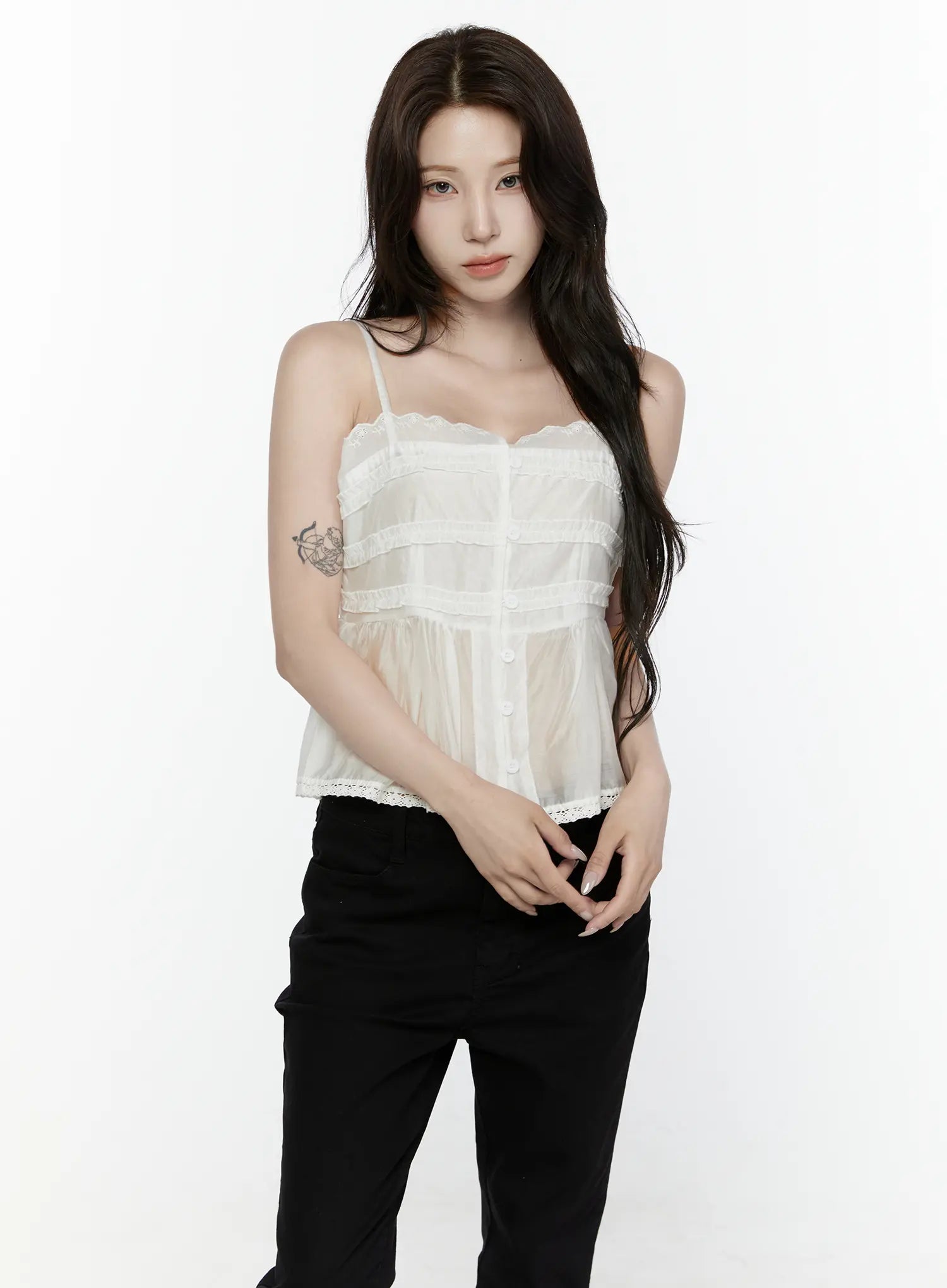 Lace Trim Tank IL521 White front shot on model standing upright arms relaxed styled with black pants showing full top silhouette