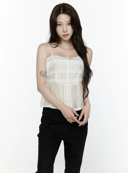 Lace Trim Tank IL521 White front shot on model standing upright arms relaxed styled with black pants showing full top silhouette