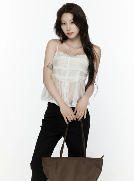 LEWKIN Lace Trim Tank IL521 White S/M front shot on model holding brown tote bag, sheer organza fabric with ruffle tiers and lace hem