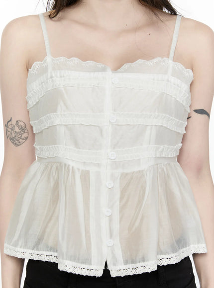 Lace Trim Tank IL521 White close-up front detail shot showing scallop lace neckline tiered ruffles center buttons and eyelet lace hem