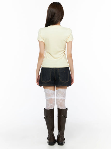Lace Trim V-Neck Tee IL523 Yellow back model shot showing clean fitted ribbed back hem with dark denim shorts lace socks brown knee boots