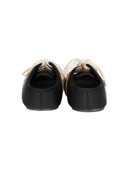 Lace-Up Slide Slippers CU530 Black back flat lay pair, displaying open backless heel, smooth black upper, and cream lace ends detail