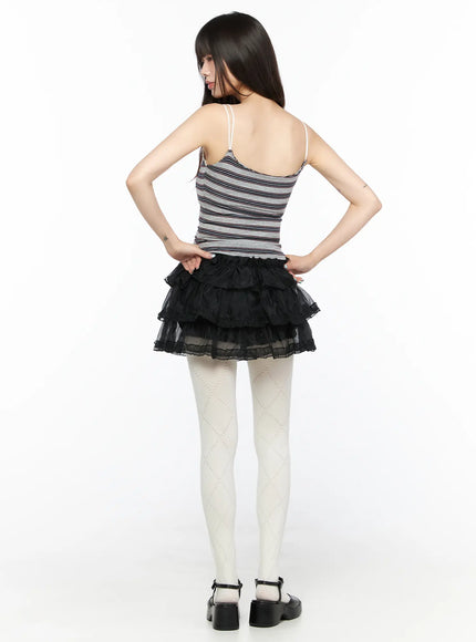 Lace V-Neck Striped Top CL522 Gray back view model hands on hips revealing open back spaghetti straps and horizontal stripe knit texture paired with black tiered tulle mini skirt