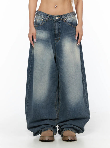 Lane Washed Wide Leg Jeans CU523 Blue close-up front waist shot on model showing low-rise V-waistband, button fly, front pockets, and heavy wash fading detail