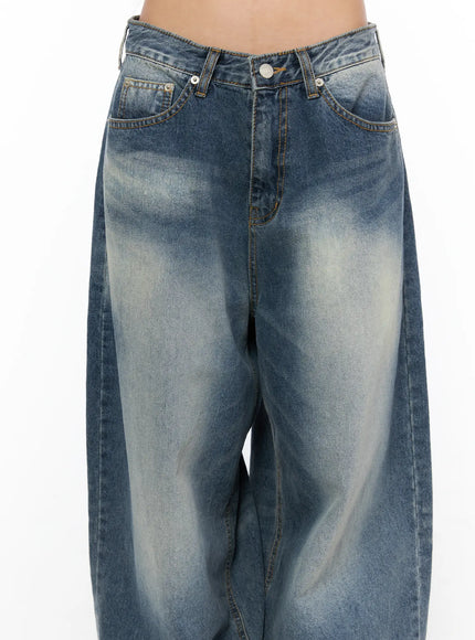 Lane Washed Wide Leg Jeans CU523 Blue close-up front waist detail showing V-cut low-rise waistband, button closure, and heavy sand-washed indigo denim texture