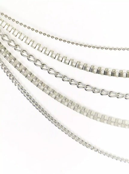 Layered Belt Chain IL516 Silver close-up detail of layered multi-texture silver chains including box link ball and curb styles shown diagonally on white background