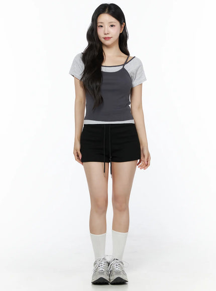 Layered Cami Striped Tee IU525 Dark gray model full-body front shot standing straight arms at sides showing complete layered silhouette with sneakers and white socks