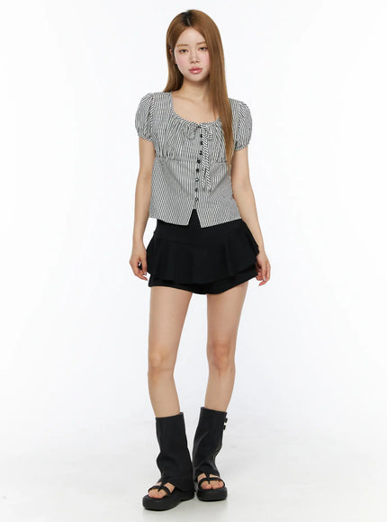Layered Flounce Mini Skirt CL502 Black full-length front view on model paired with striped puff-sleeve top and platform sandals