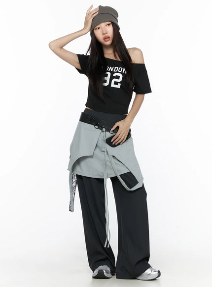 Layered Lace Mini Skirt CL524 Gray full-body front on model wearing gray beanie and black off-shoulder top, layered skirt with lace and ribbon details