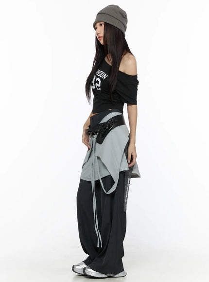 Layered Lace Mini Skirt CL524 Gray full-body side on model in gray beanie and black off-shoulder top, showing skirt length and lace side panel