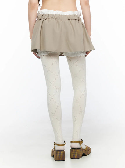 Layered Low-Rise Mini Skirt CL523 Beige back model shot showing flared skirt silhouette elasticated waistband and white ruffle inner layer hem