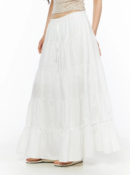 Layered Maxi Skirt CU530 white close-up front shot on model showing elastic drawstring waistband and tiered cotton panels from hip to hem