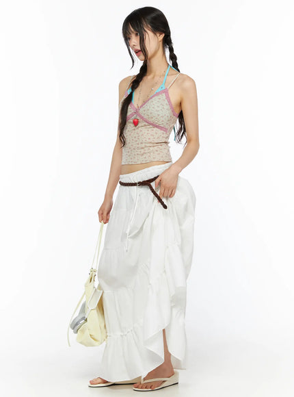 LEWKIN Layered Maxi Skirt CU530 white side shot on model with braided pigtails wearing floral cami top and brown braided belt holding bag